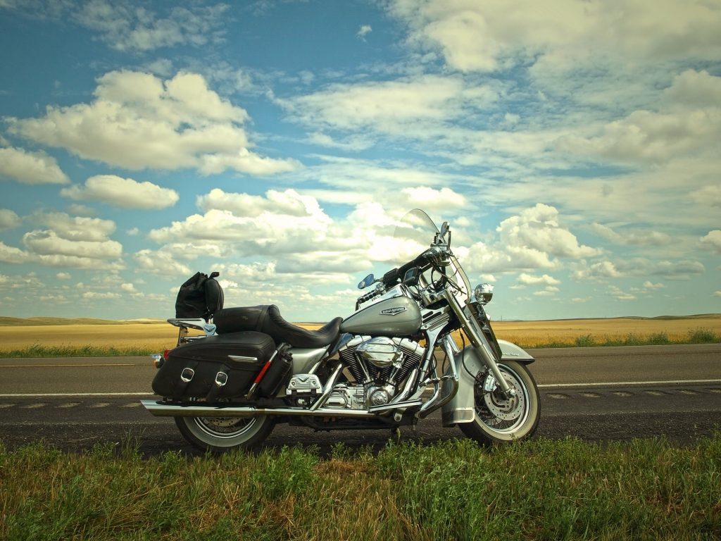 Motorcycle parked on the side of the highway